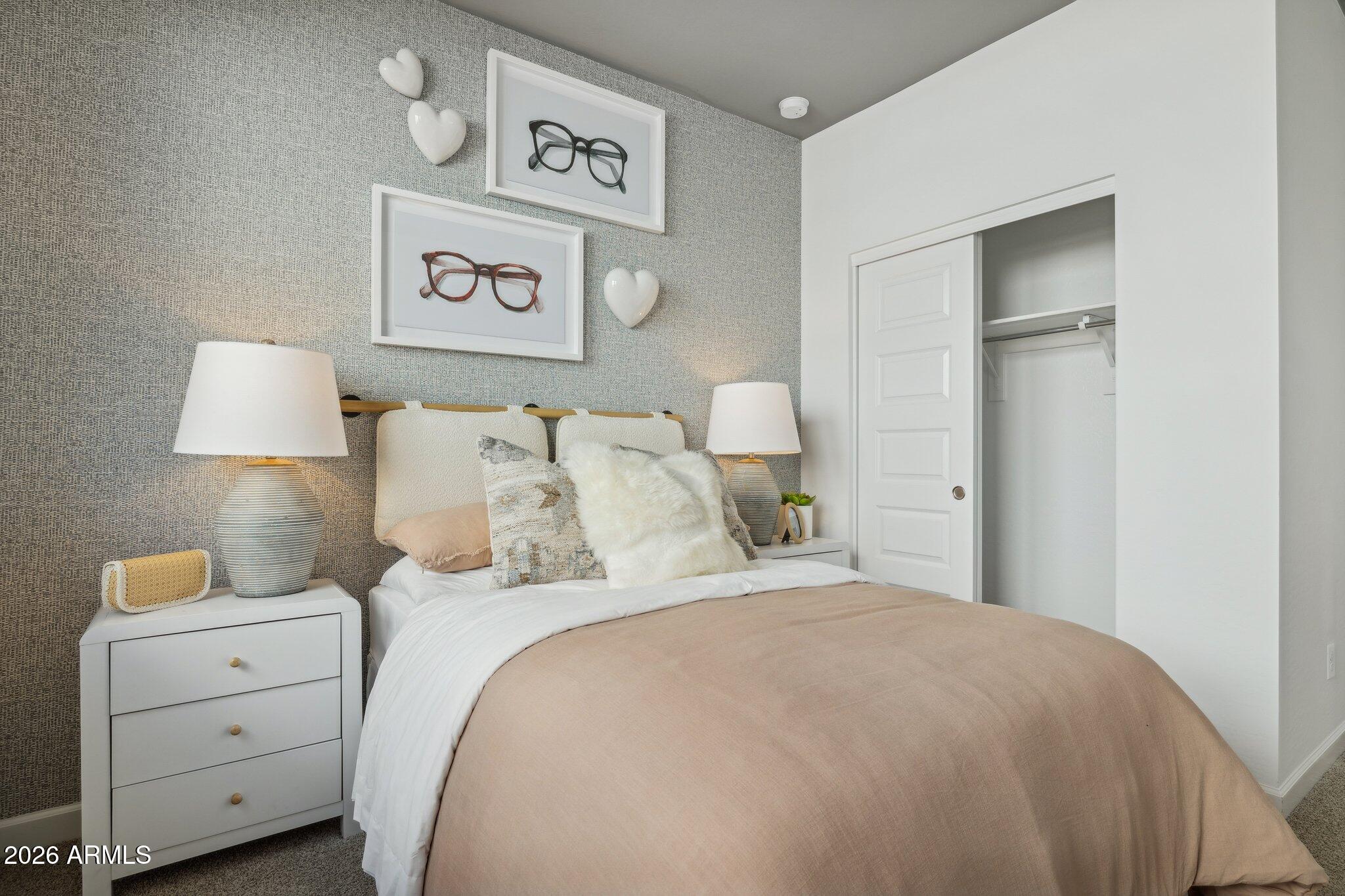 26449 West Crown King Road Buckeye, AZ 85326 - Photo 23 of 33 a bedroom with a bed and a night stand