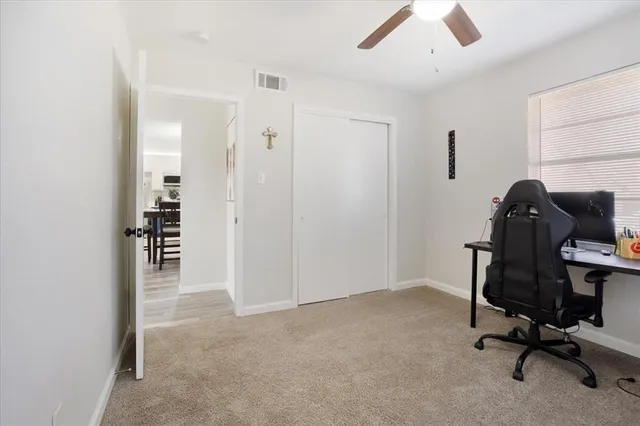 a view of a workspace with furniture