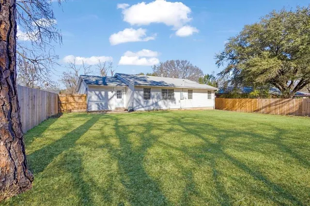 a view of a house with a big yard