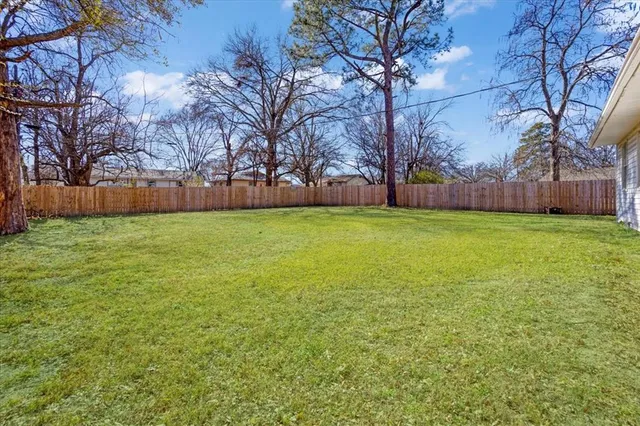 a view of a yard with trees