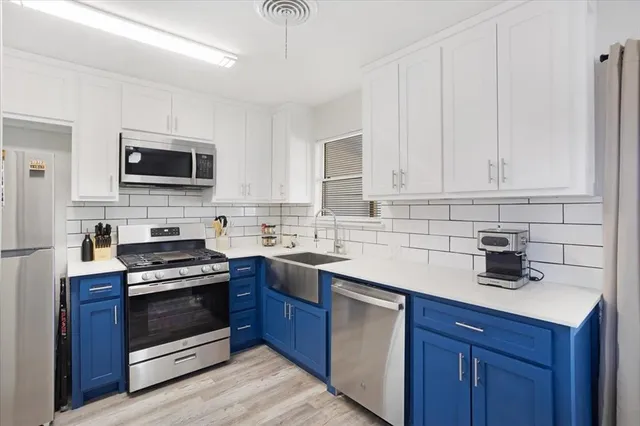 a kitchen with a stove and a microwave