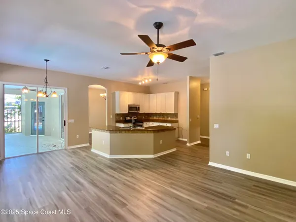 a view of a kitchen with a sink and a kitchen view