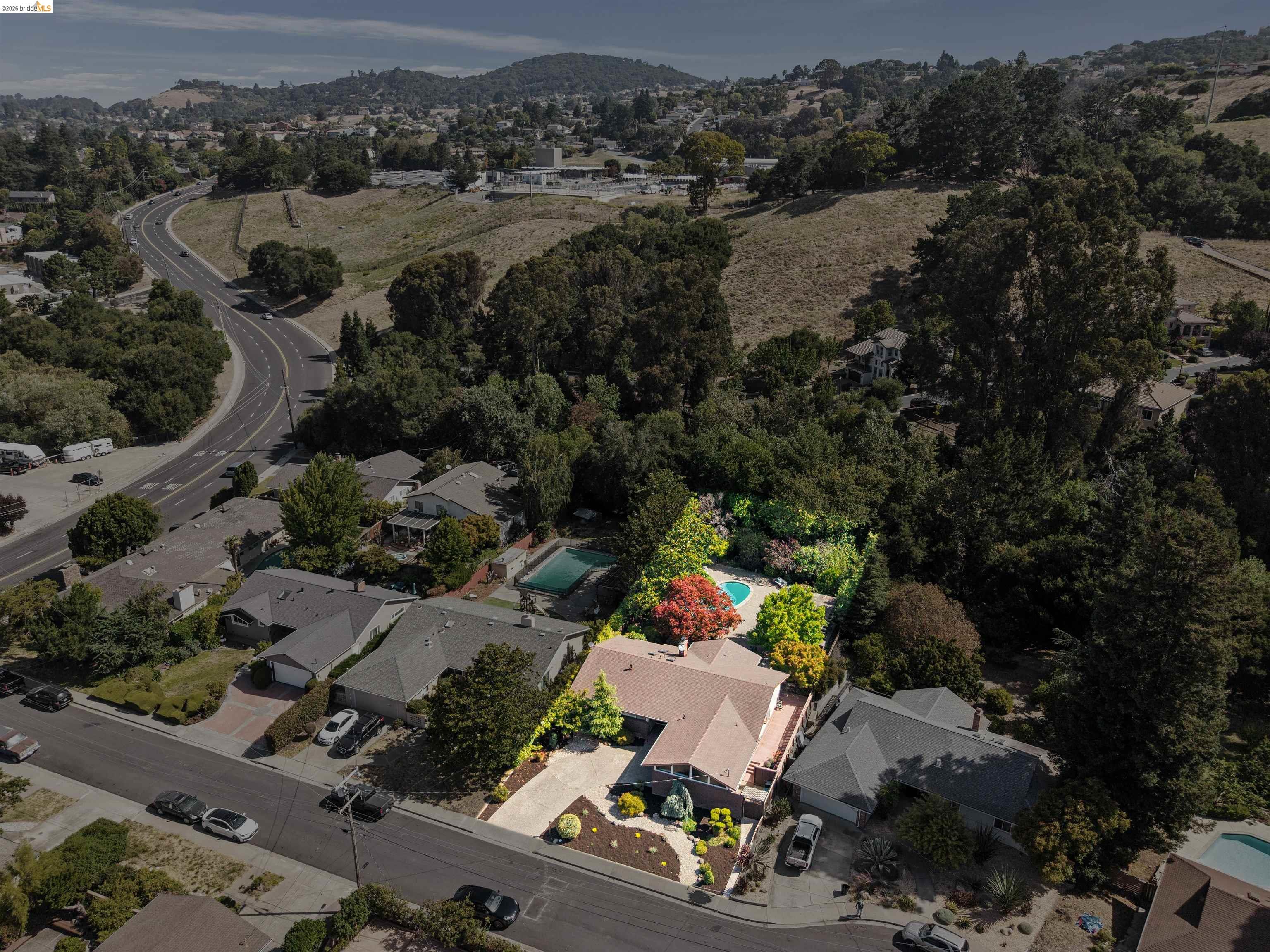 7 Jo Lin Court El Sobrante, CA 94803 - Photo 4 of 99 Aerial perspective highlighting a single-story residence with a light-colored roof