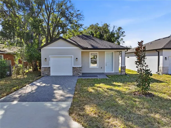 a house with trees in the background