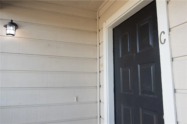a kitchen with a sink a stove a refrigerator and cabinets