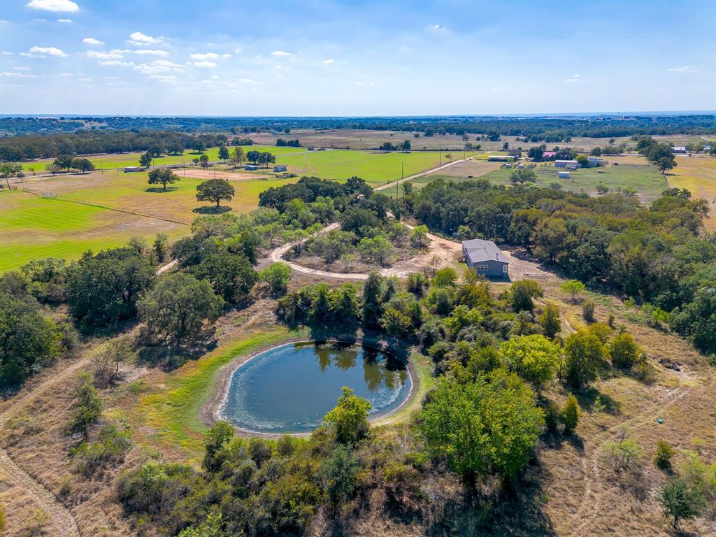 5878 Greenwood Road Millsap, TX 76066 - Photo 13 of 40 an aerial view of residential houses with outdoor space and swimming pool