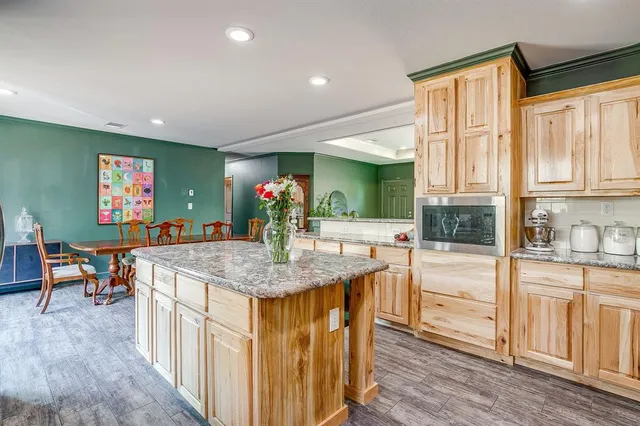 a kitchen with stainless steel appliances granite countertop a stove and a sink