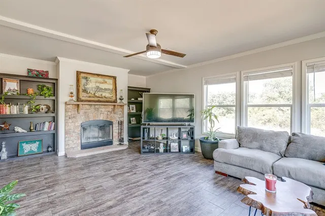 a living room with furniture and a fireplace