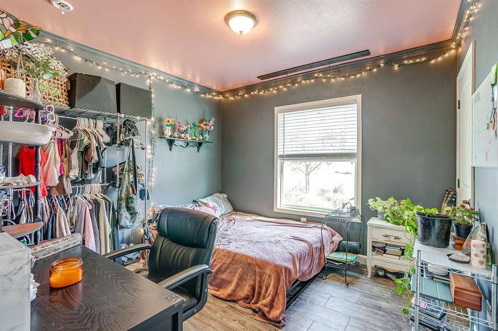 5878 Greenwood Road Millsap, TX 76066 - Photo 28 of 40 a bedroom with a bed and a window