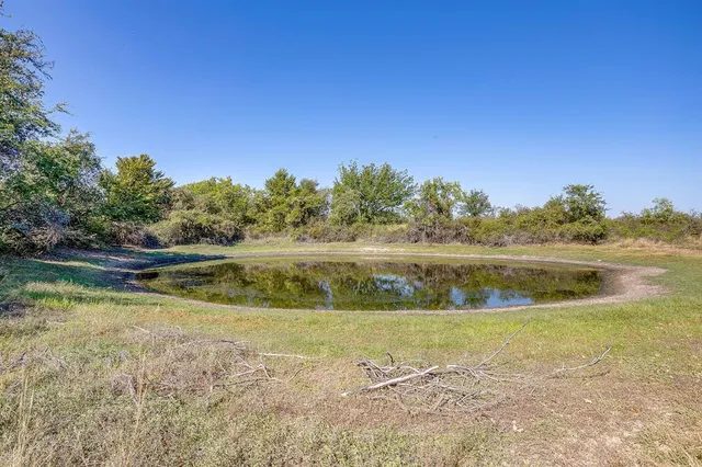 a view of a lake with a yard