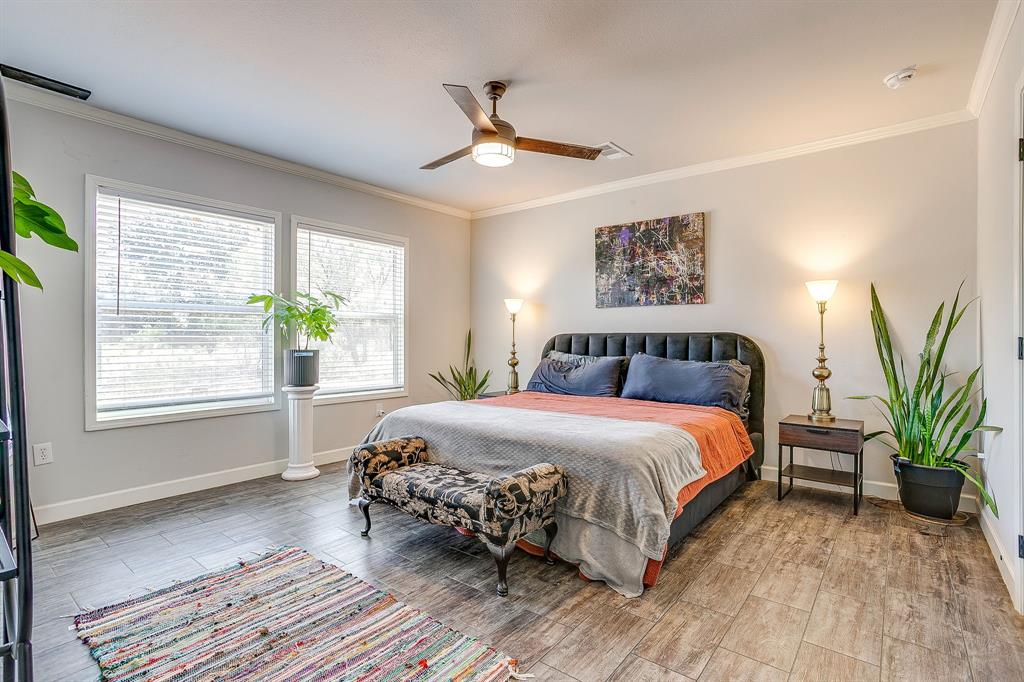 5878 Greenwood Road Millsap, TX 76066 - Photo 5 of 40 a bedroom with a large bed and a window