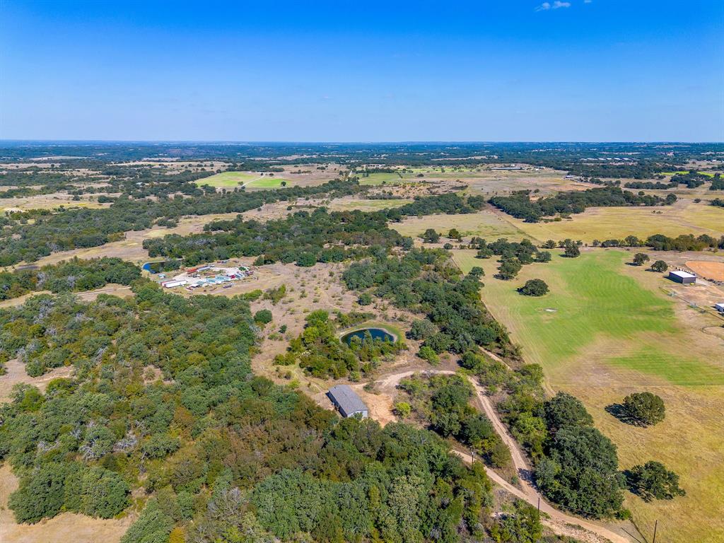 5878 Greenwood Road Millsap, TX 76066 - Photo 9 of 40 an aerial view of residential houses with outdoor space