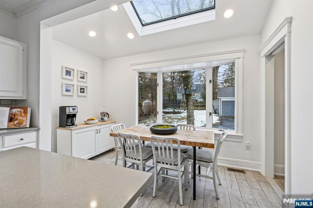 97 Montclair Avenue Montclair, NJ 07042 - Photo 12 of 42 a view of a dining room with furniture and wooden floor