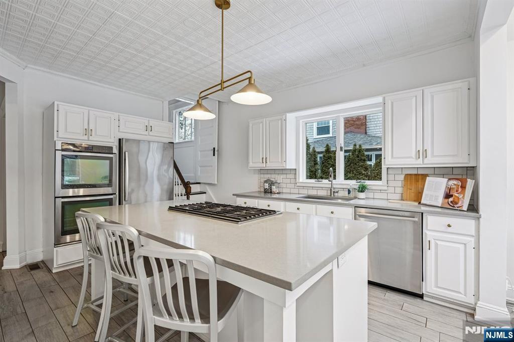 97 Montclair Avenue Montclair, NJ 07042 - Photo 14 of 42 a kitchen with sink cabinets and window