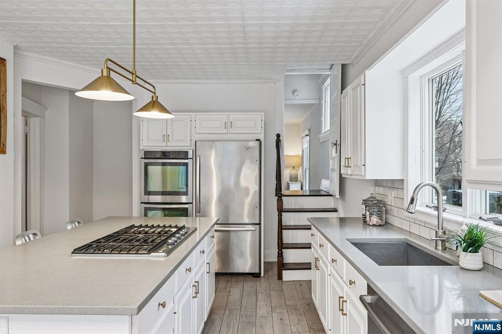 97 Montclair Avenue Montclair, NJ 07042 - Photo 17 of 42 a kitchen that has a sink cabinets counter space and stainless steel appliances