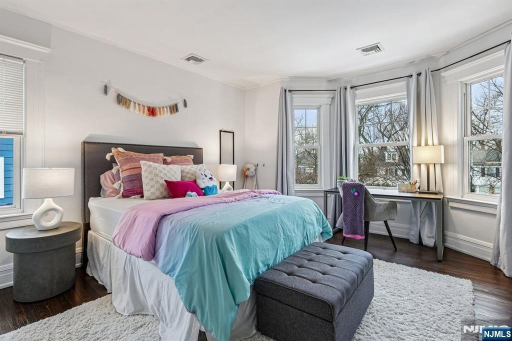 97 Montclair Avenue Montclair, NJ 07042 - Photo 18 of 42 a bedroom with a large bed and a window