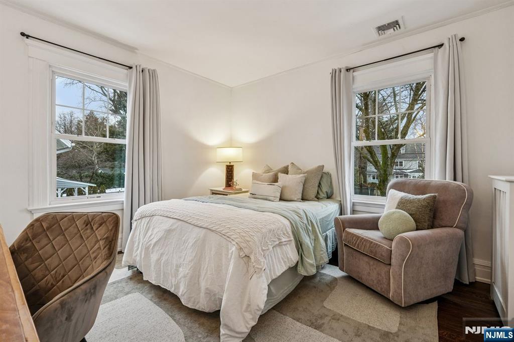 97 Montclair Avenue Montclair, NJ 07042 - Photo 19 of 42 a bedroom with a bed and a couch next to a window