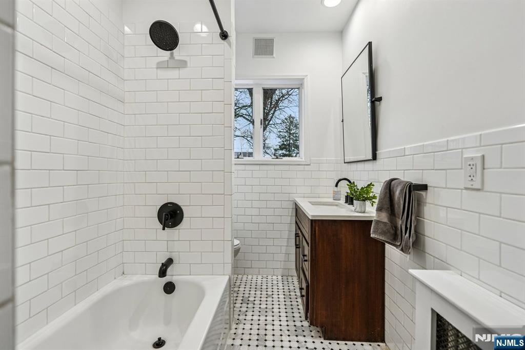 97 Montclair Avenue Montclair, NJ 07042 - Photo 22 of 42 a bathroom with a sink and a shower