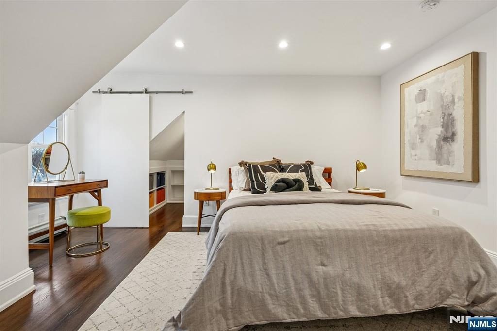 97 Montclair Avenue Montclair, NJ 07042 - Photo 23 of 42 a bedroom with a bed and wooden floor