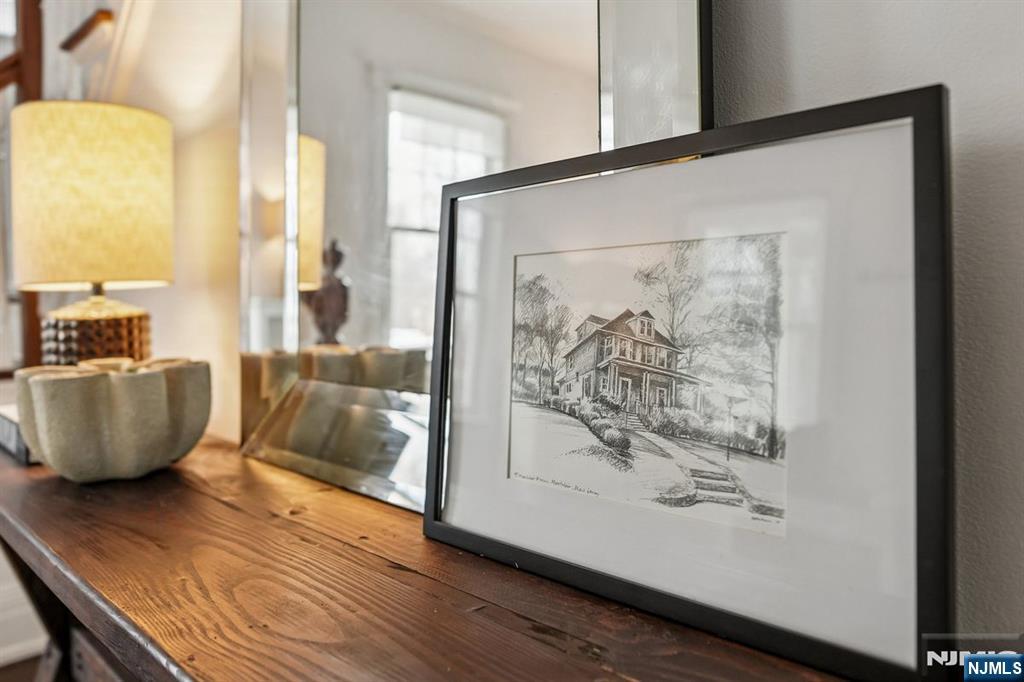 97 Montclair Avenue Montclair, NJ 07042 - Photo 39 of 42 a room with wooden floor and a mirror