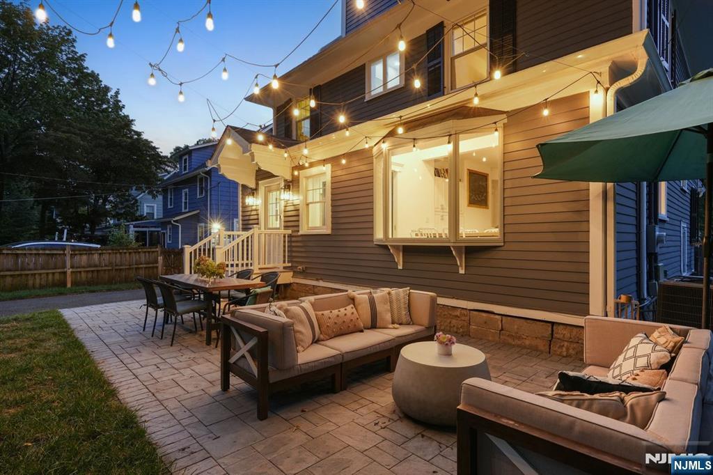 97 Montclair Avenue Montclair, NJ 07042 - Photo 40 of 42 a view of a patio with couches table and chairs and potted plants