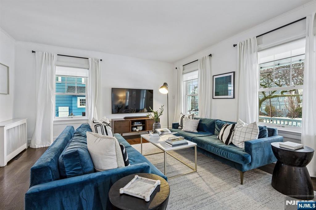 97 Montclair Avenue Montclair, NJ 07042 - Photo 5 of 42 a living room with furniture a flat screen tv and a large window