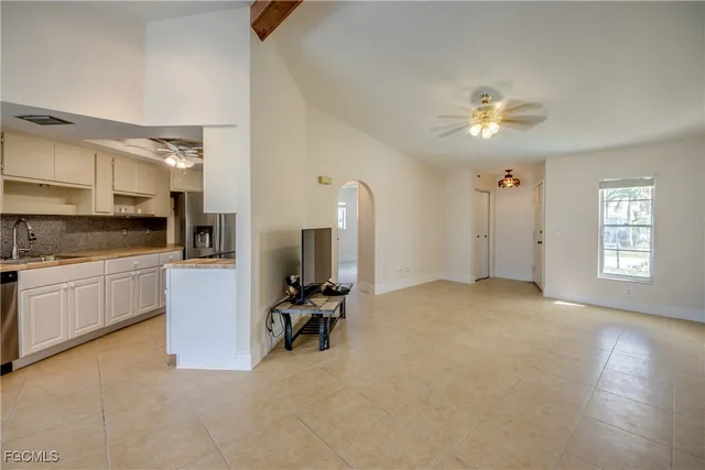 a view of room with workspace and a window