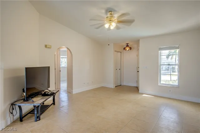 a view of an empty room with a window
