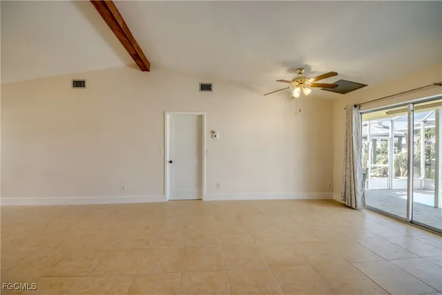 a view of room with window and ceiling fan