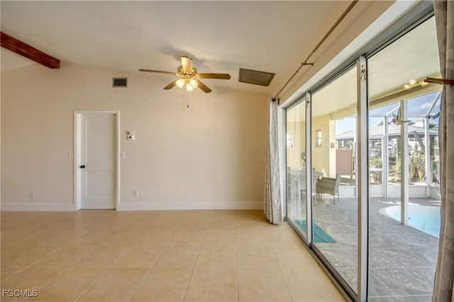 a view of n empty room with window