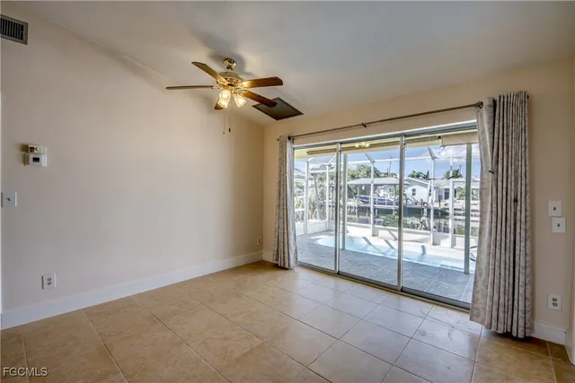 a large kitchen with stainless steel appliances granite countertop a stove a sink and a microwave