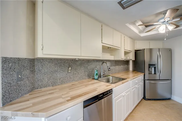 a stove top oven sitting inside of a kitchen