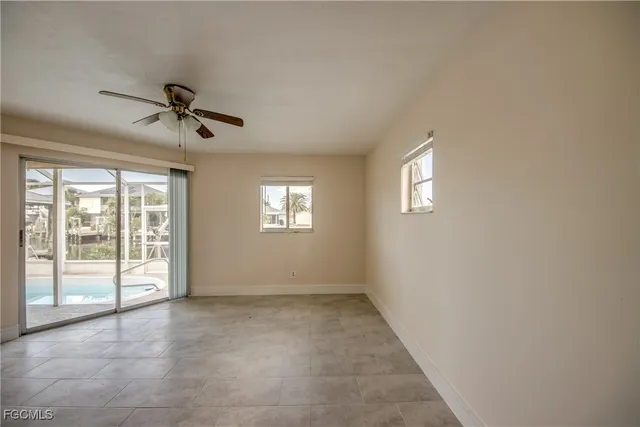 a view of room with window and ceiling fan