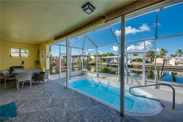 a bedroom with a bed and glass door
