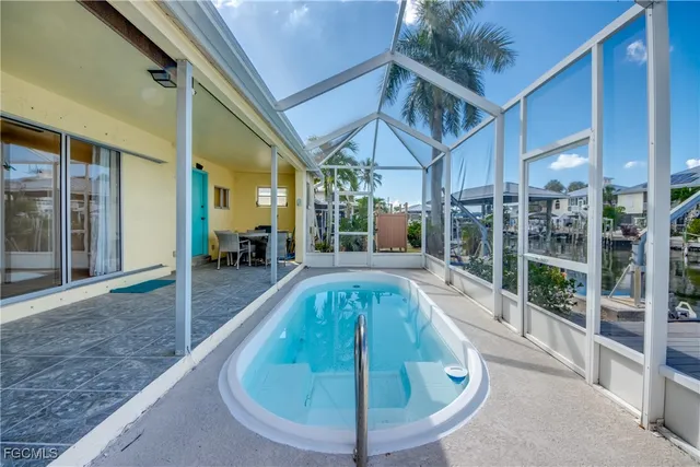 a view of a swimming pool with a patio