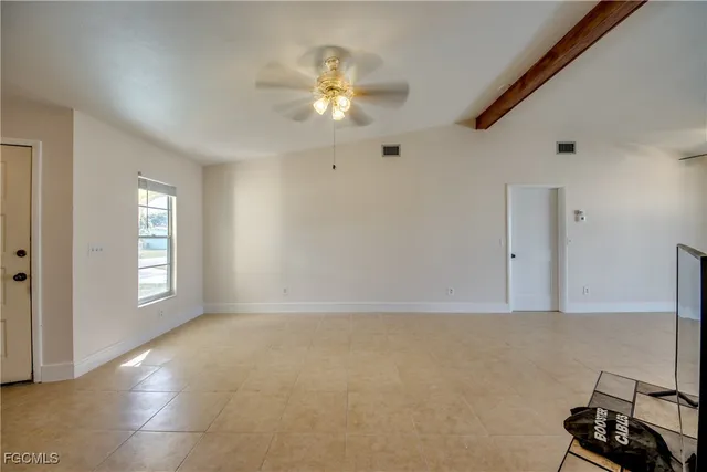 a view of a hallway with a window