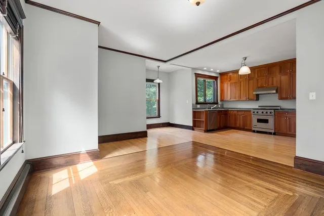 a view of a kitchen with a sink and a large window