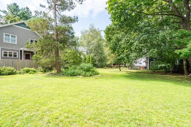 a house view with swimming pool in front of it