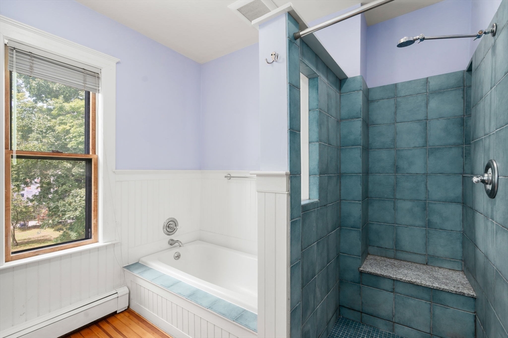 40 Cushing Street, Unit 40 Cambridge, MA 02138 - Photo 25 of 42 a bathroom with a bathtub and a shower