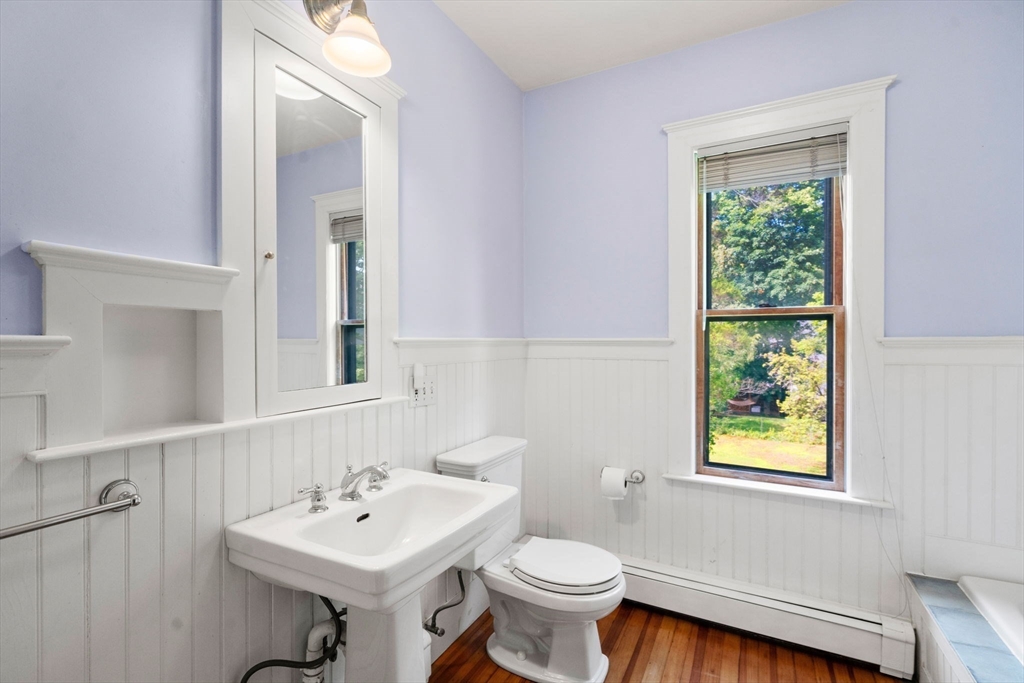 40 Cushing Street, Unit 40 Cambridge, MA 02138 - Photo 26 of 42 a bathroom with a sink a toilet and a mirror