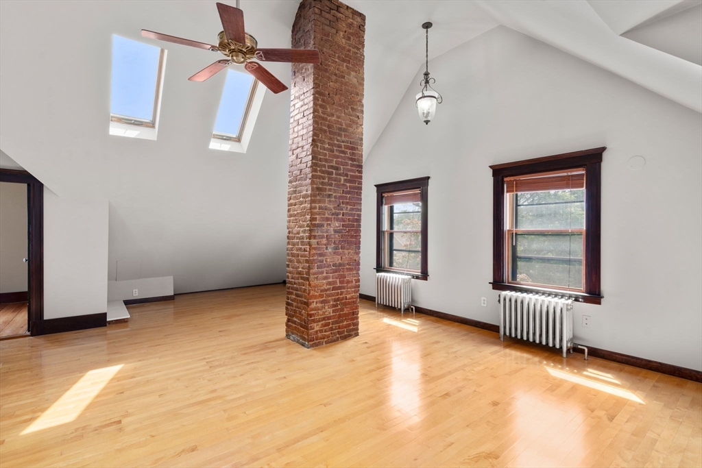 40 Cushing Street, Unit 40 Cambridge, MA 02138 - Photo 28 of 42 an empty room with windows