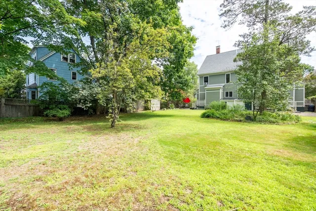 a view of a garden with a house