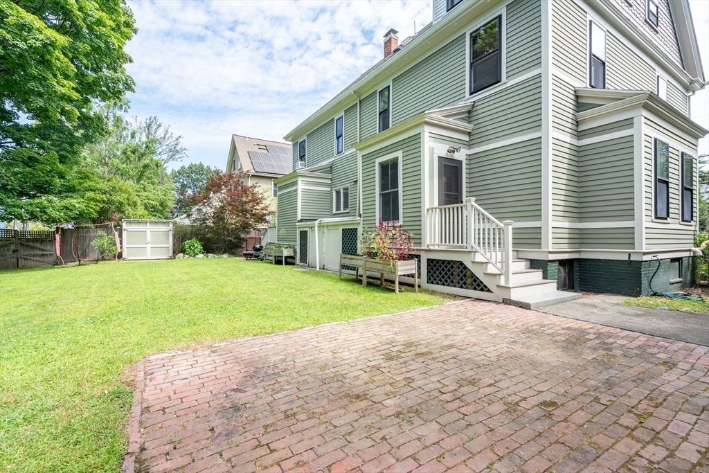 40 Cushing Street, Unit 40 Cambridge, MA 02138 - Photo 36 of 42 a view of a house with a yard and pathway