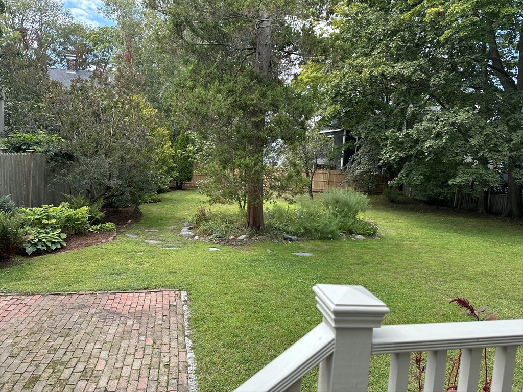 40 Cushing Street, Unit 40 Cambridge, MA 02138 - Photo 40 of 42 a view of a backyard with a garden