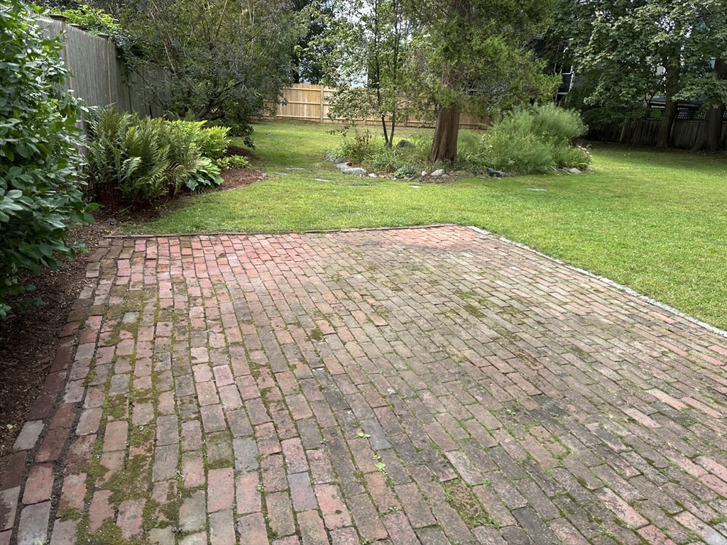 40 Cushing Street, Unit 40 Cambridge, MA 02138 - Photo 41 of 42 a view of yard with swimming pool and green space