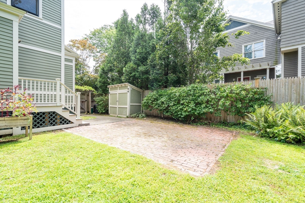 40 Cushing Street, Unit 40 Cambridge, MA 02138 - Photo 5 of 42 a view of a house with backyard and sitting area