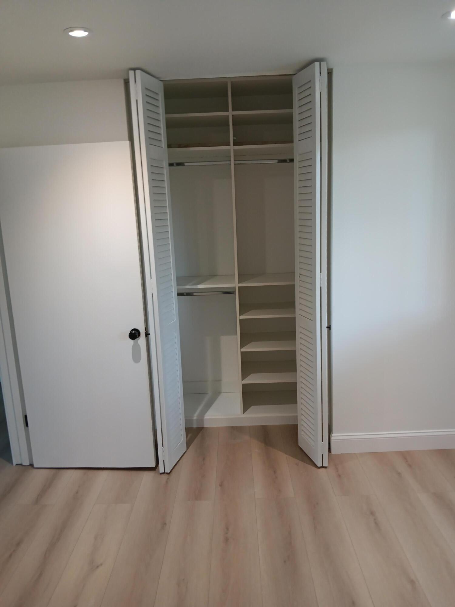 2760 Banyan Road, Unit A6 Boca Raton, FL 33432 - Photo 49 of 57 Second bedroom closet with organizers, r