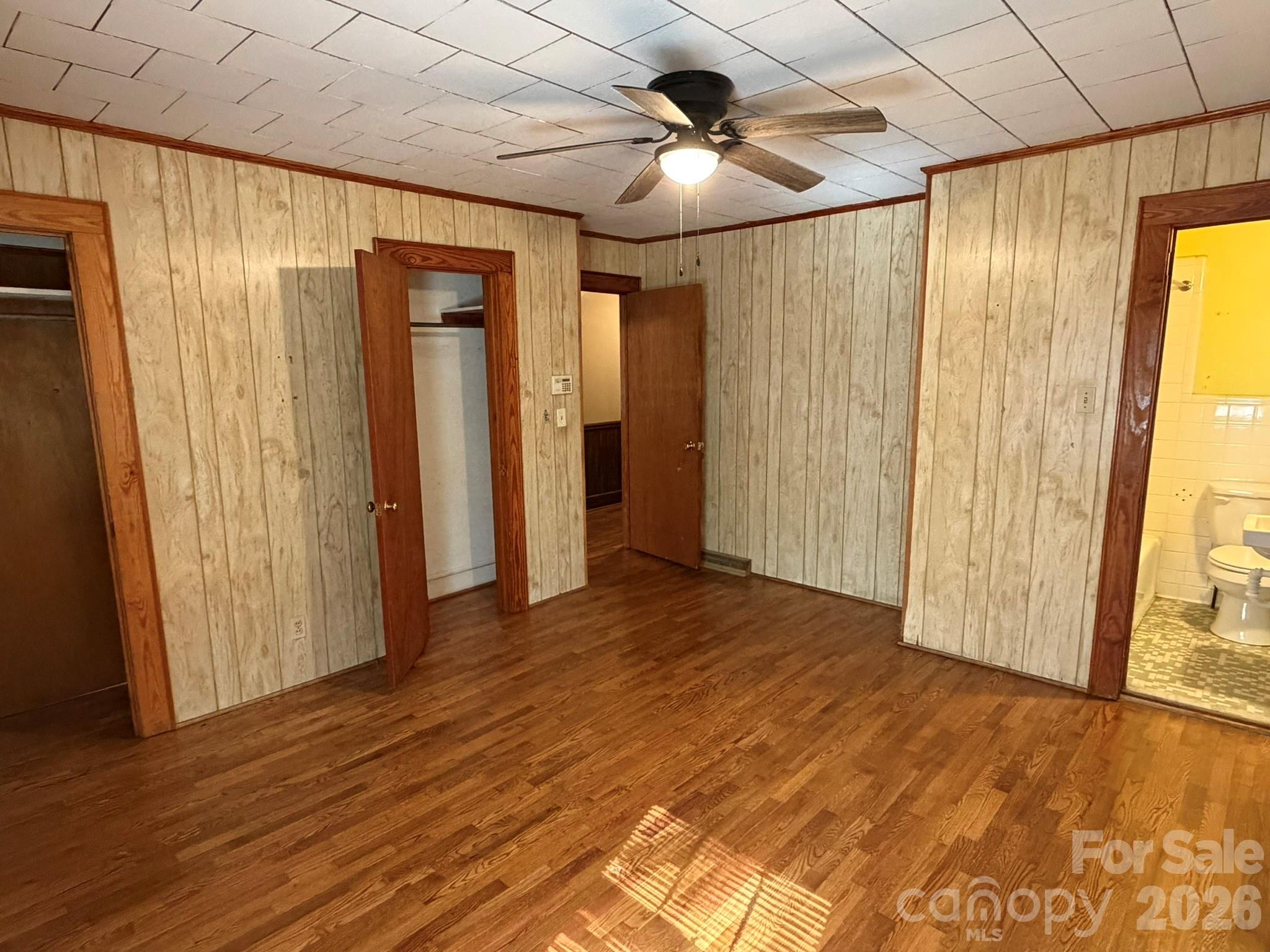 382 Alexis High Shoals Road Dallas, NC 28034 - Photo 21 of 43 a view of empty room with wooden floor and fan