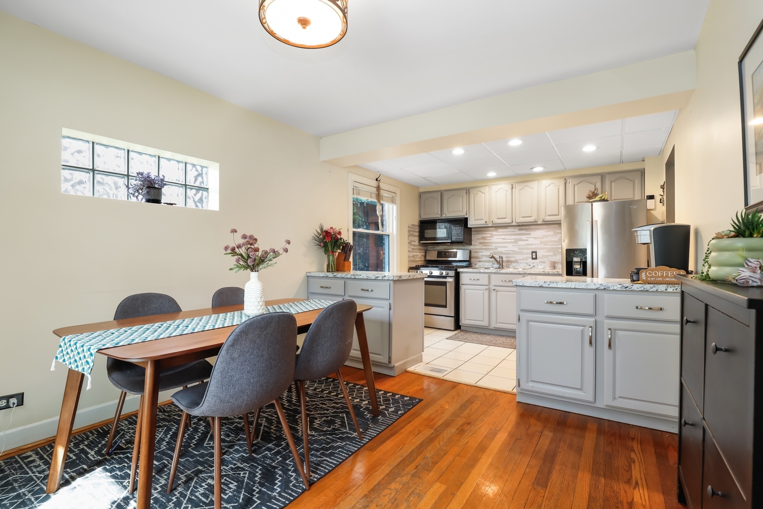 2357 South 3rd Avenue North Riverside, IL 60546 - Photo 6 of 28 a kitchen with cabinets table and chairs