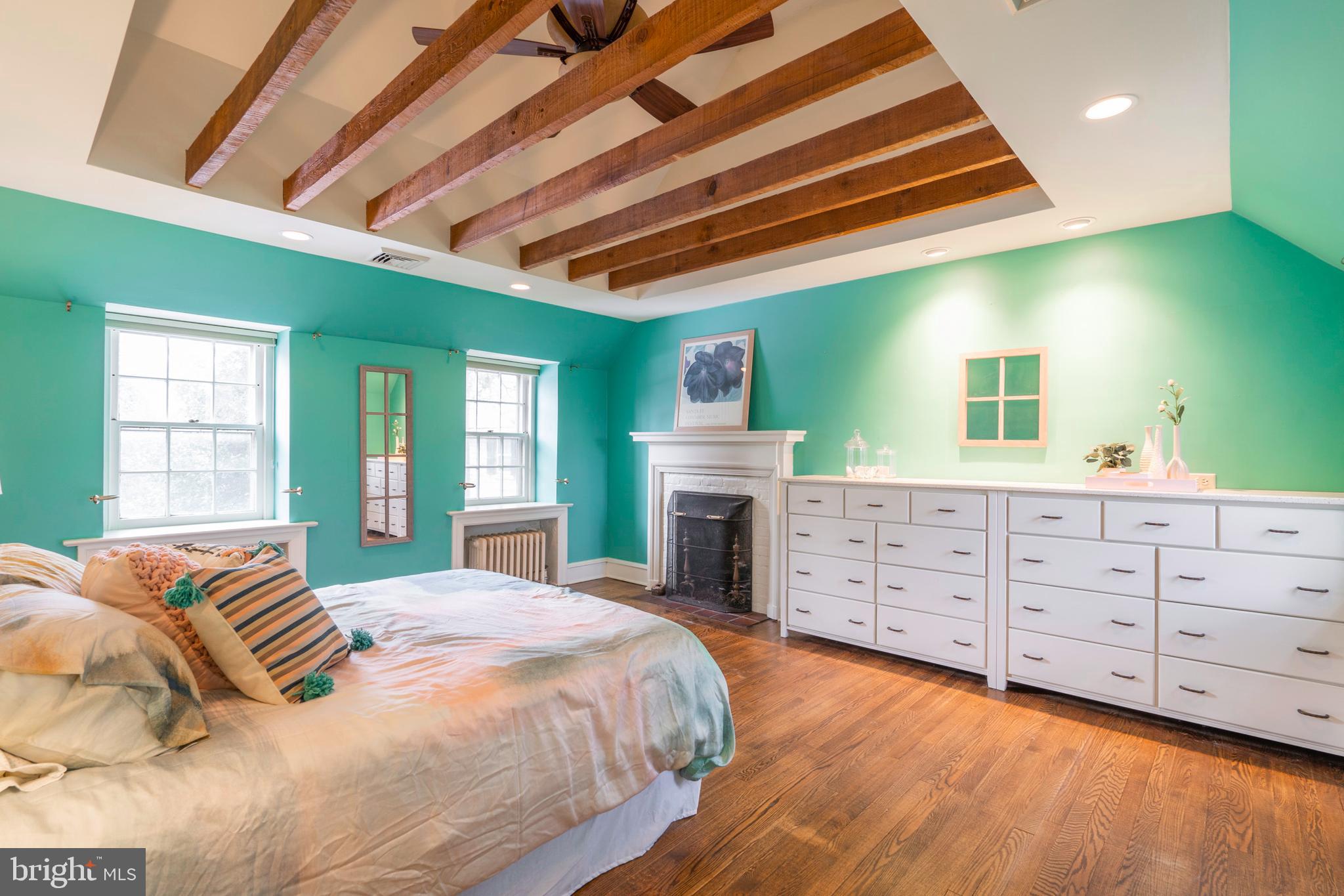 325 Roumfort Road Philadelphia, PA 19119 - Photo 30 of 57 Main bedroom w/built-ins, fp, beamed ceiling